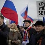 Pro-Putin demonstrators held Russian national flags and posters reading “Crimea is Russian land!” in Moscow.